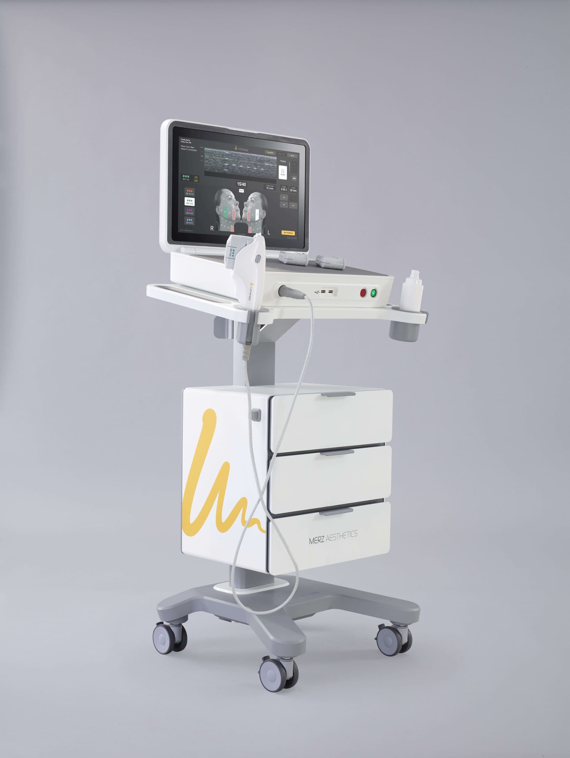 Ultherapy medical aesthetic device on a white rolling cart with a screen and handheld applicator.